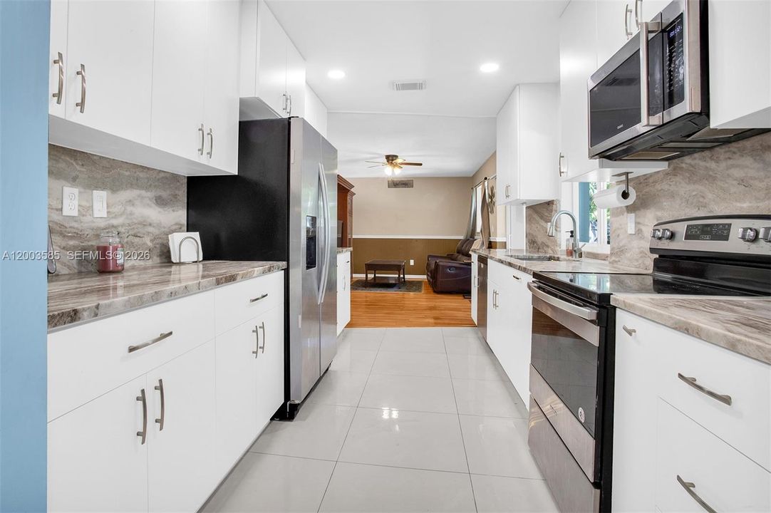 LARGE CLEAN KITCHEN WITH CHEF WINDOW