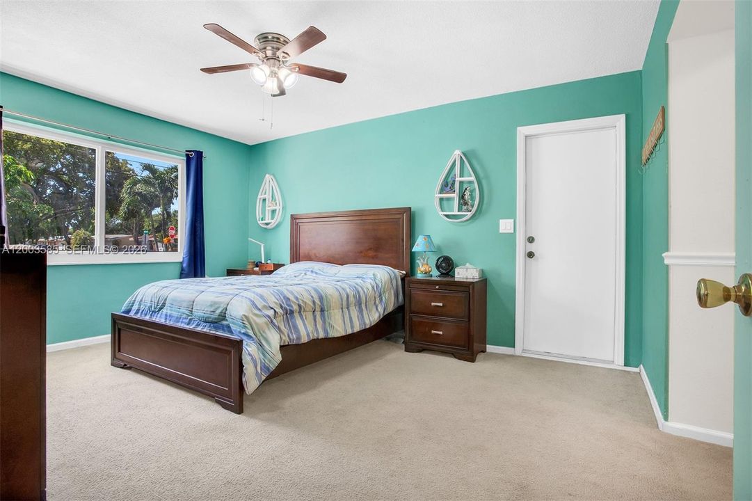 PRIMARY BEDROOM LEADING TO GARAGE