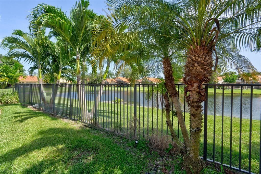 VIEW FROM THE BACK YARD FENCE TO LAKE