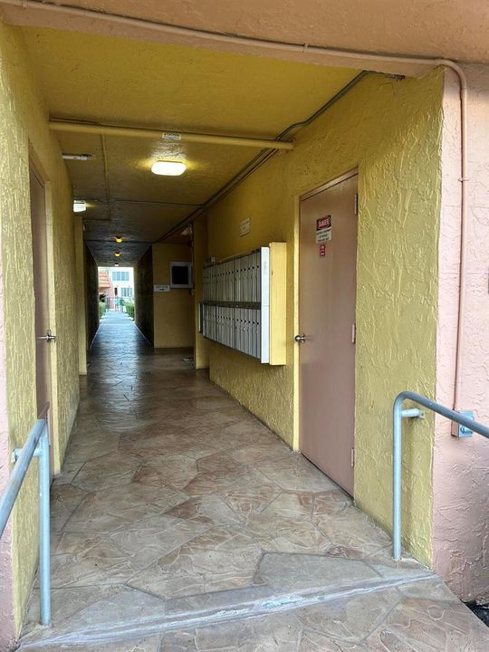MAILBOXES BY ELEVATOR AT ENTRANCE