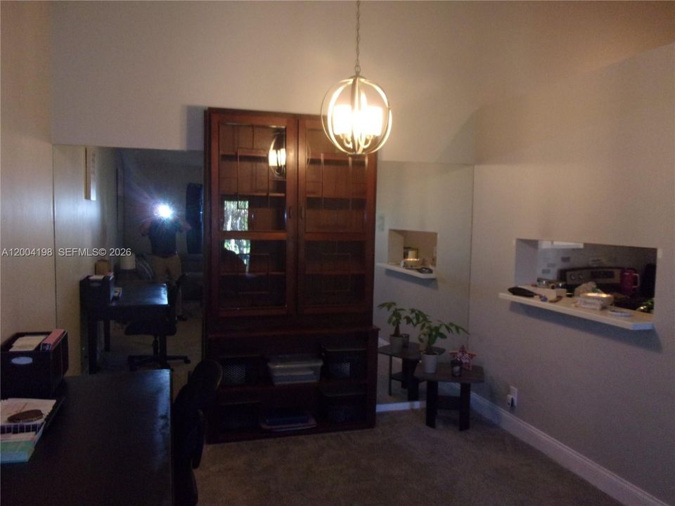 The dining area has a pass through to the renovated kitchen