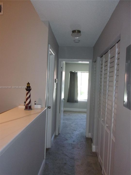 The hallway leads to both bedrooms, insuite laundry and 2nd full bathroom