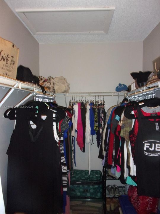 The primary walkin closet also has attic access for your larger storage needs