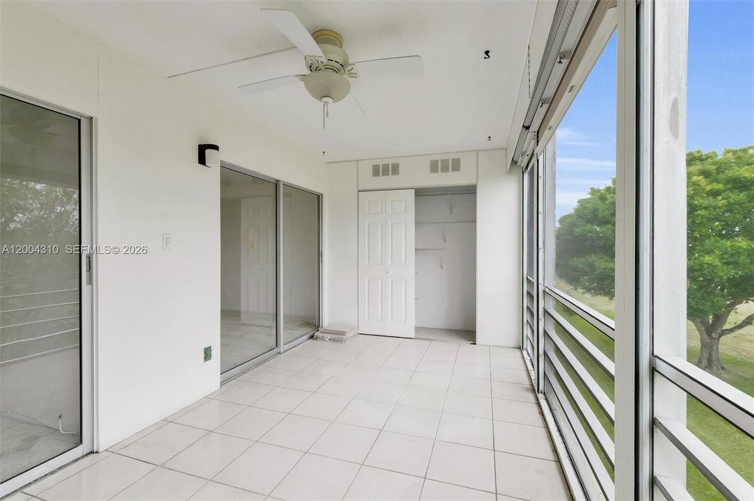Patio with full size closet & ceiling fan