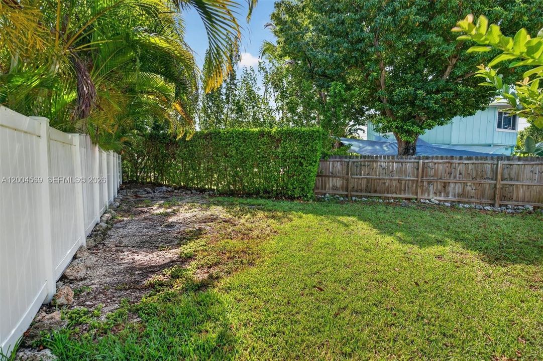 Spacious yard with room for a boat or future expansion.