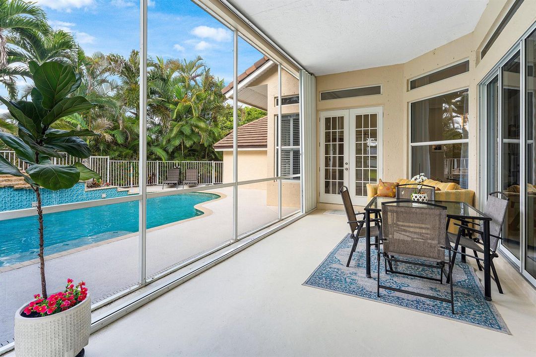 Screen-in porch overlooking the pool