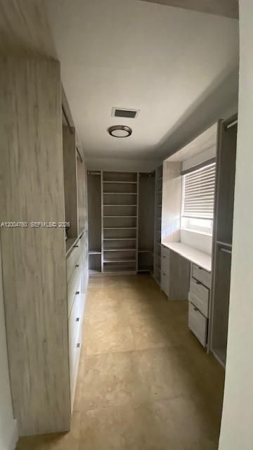 Walk-in closet in primary br