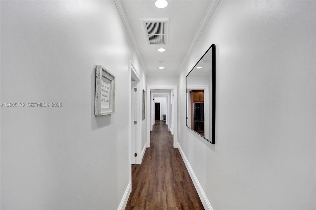 Hall way to Primary, Laundry room and out to the breezway screened in patio