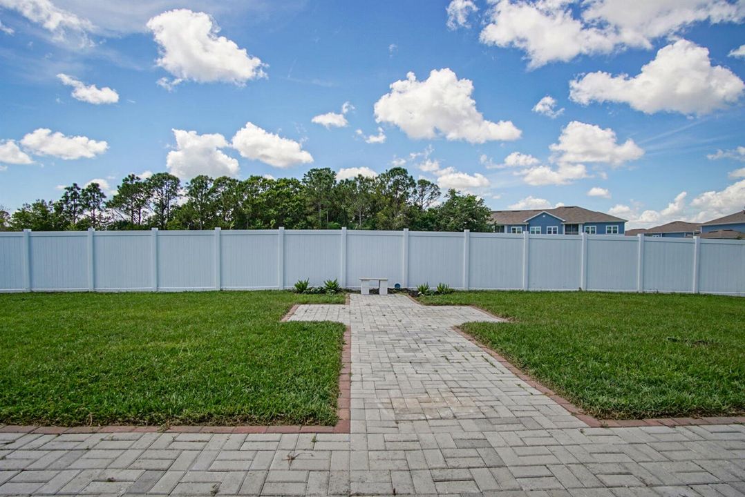Backyard patio and fenced area