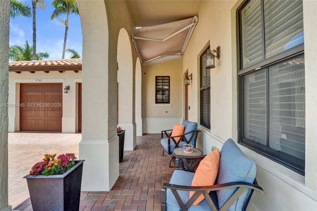 Covered patio outside front entrance to the property
