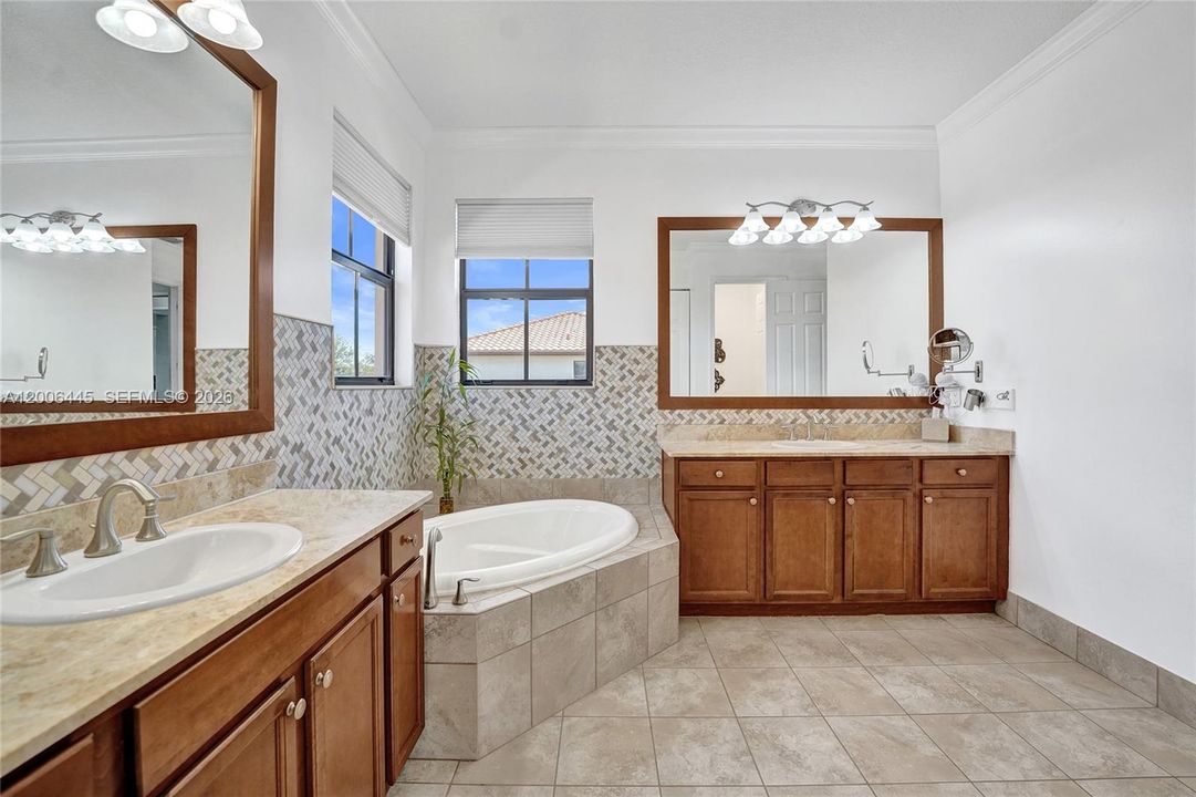 Primary Bathroom with double vanities and soaker tub
