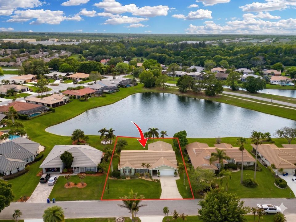 Front high aerial with pond red arrows a