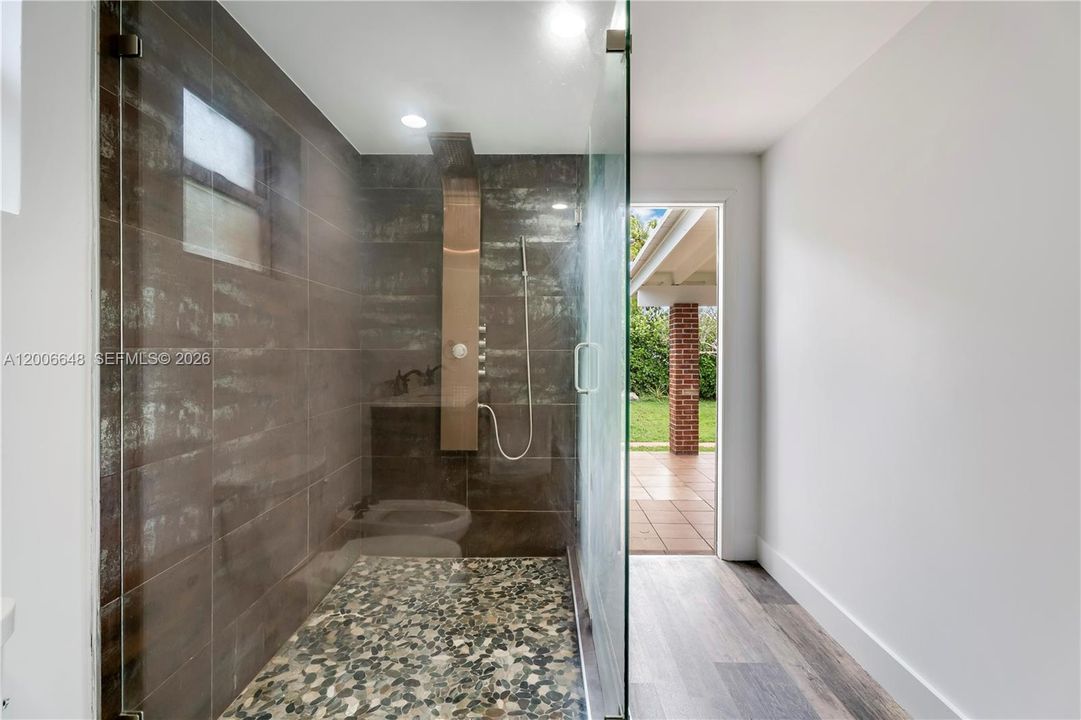 with it's en-suite shower and access to the patio