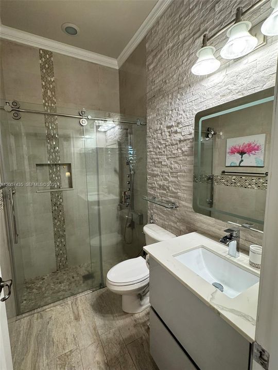 Bathroom in the room. This could be a guest room.