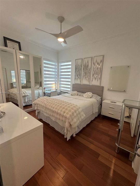 Extra closet with mirrors.