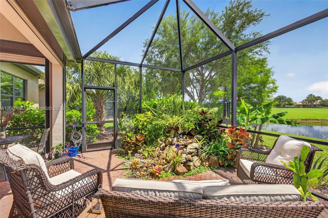 Custom Fountain & Screened Enclosure w/Serene Lake & Golf Views