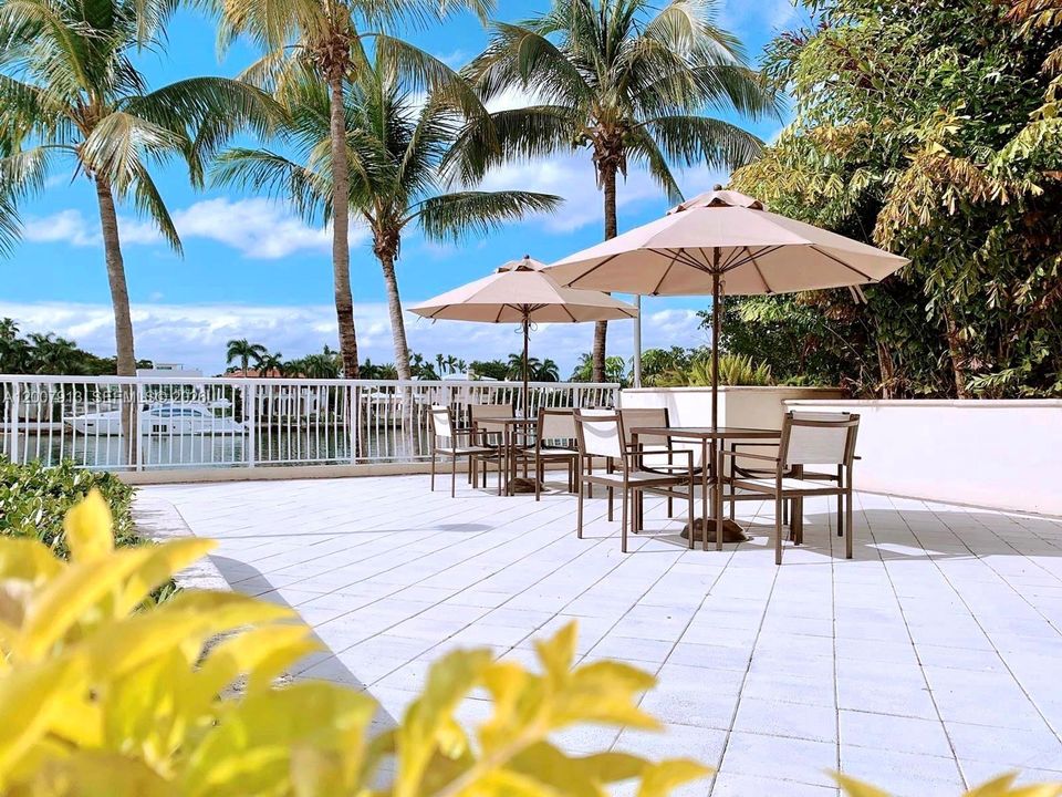 Pool - Resort-style waterfront pool with sun deck and seating areas