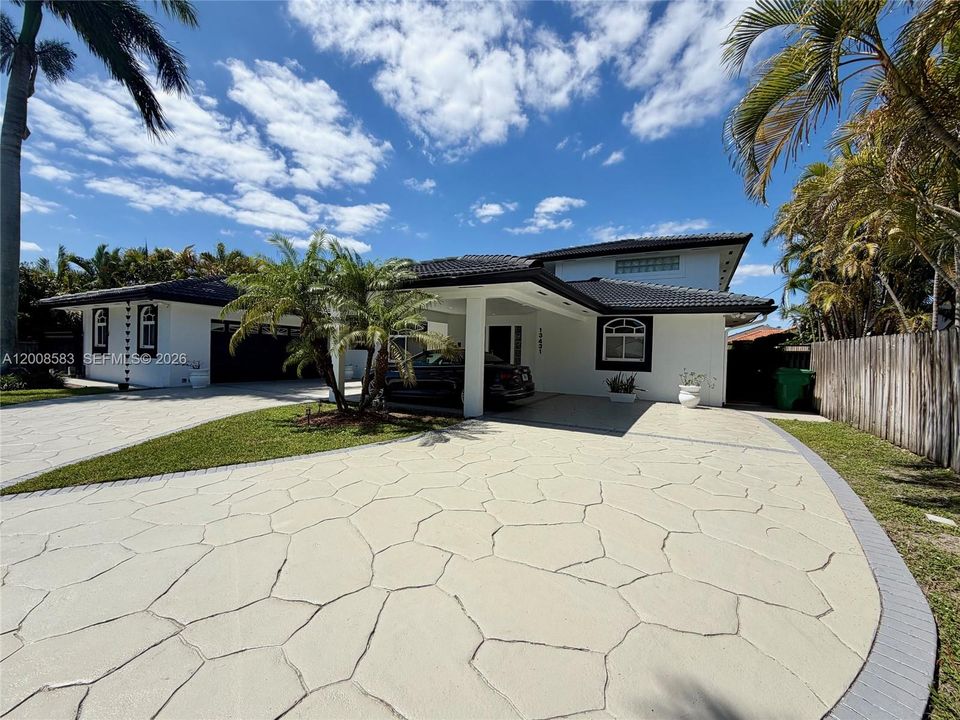 Right side of driveway and home