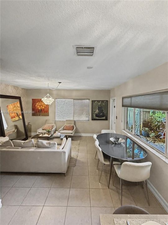 Dual-exposure corner windows flood the living space with natural light