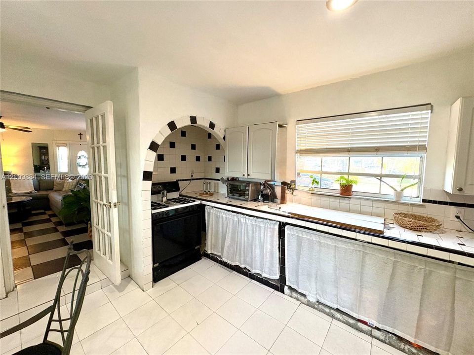 Huge kitchen with unique architectural detail over range
