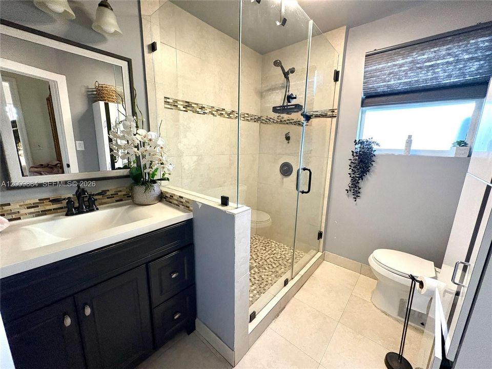 Upgraded bathroom with walk in shower
