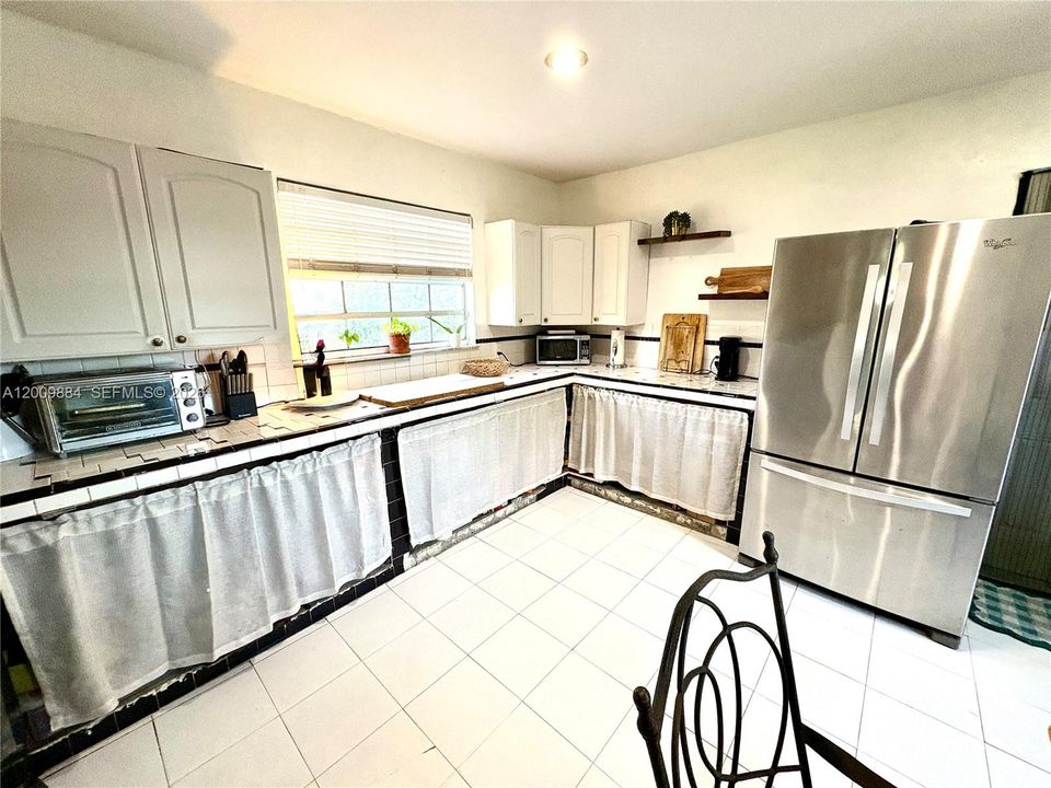 Tons of light pouring into the spacious kitchen