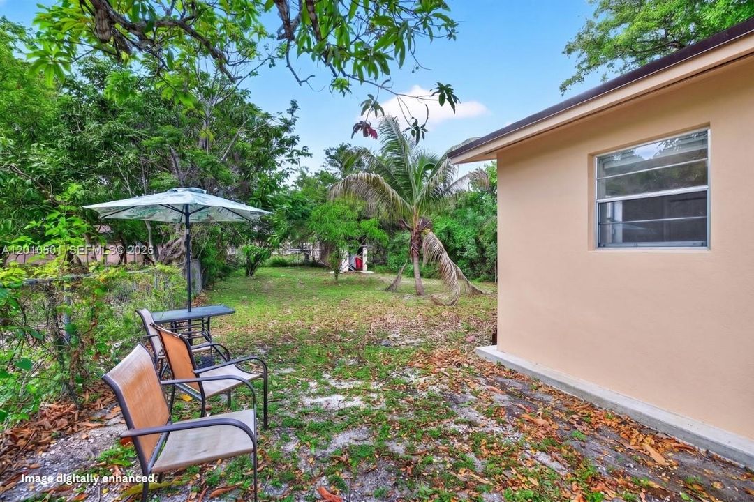 Side yard - house cleaned by virtual enhancement.