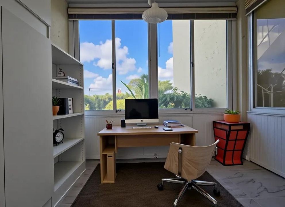 SUN ROOM CAN BE USED AS A HOME OFFICE