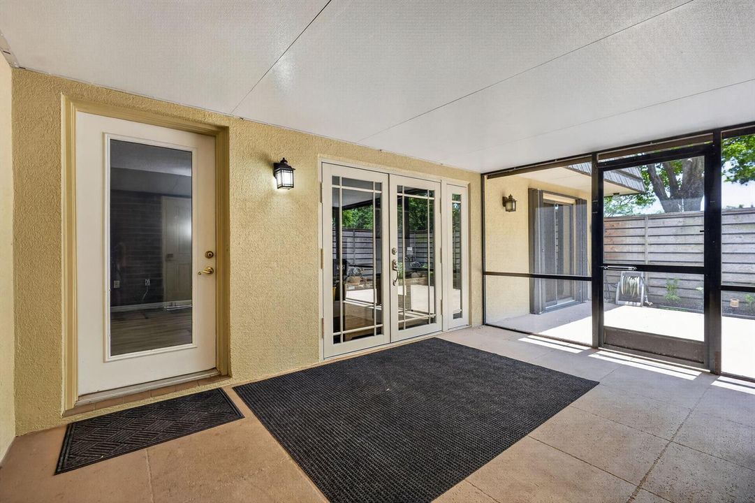 Enter into screened covered patio