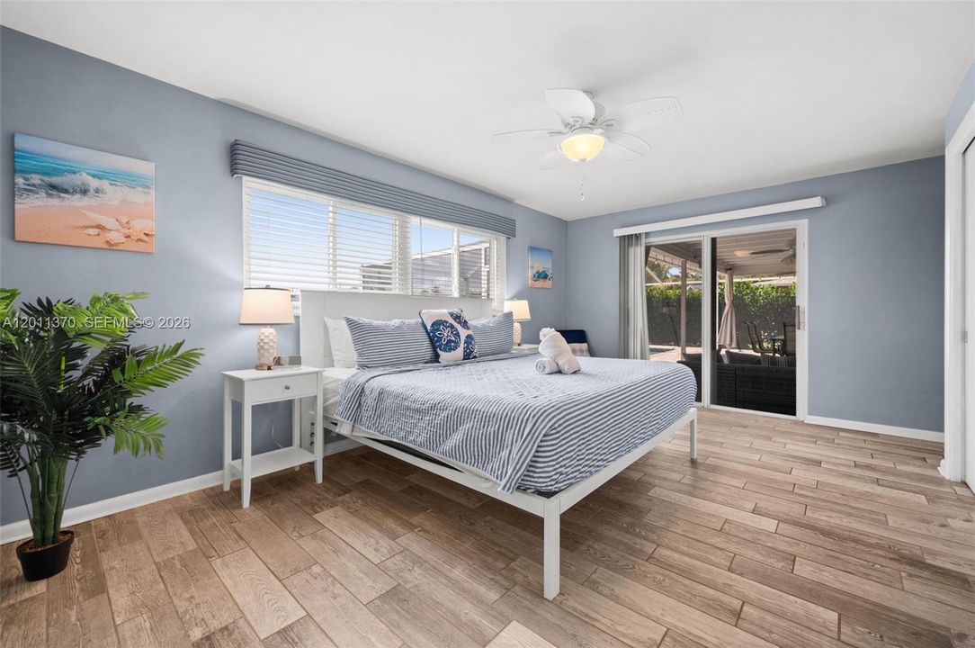Primary bedroom just steps from the pool