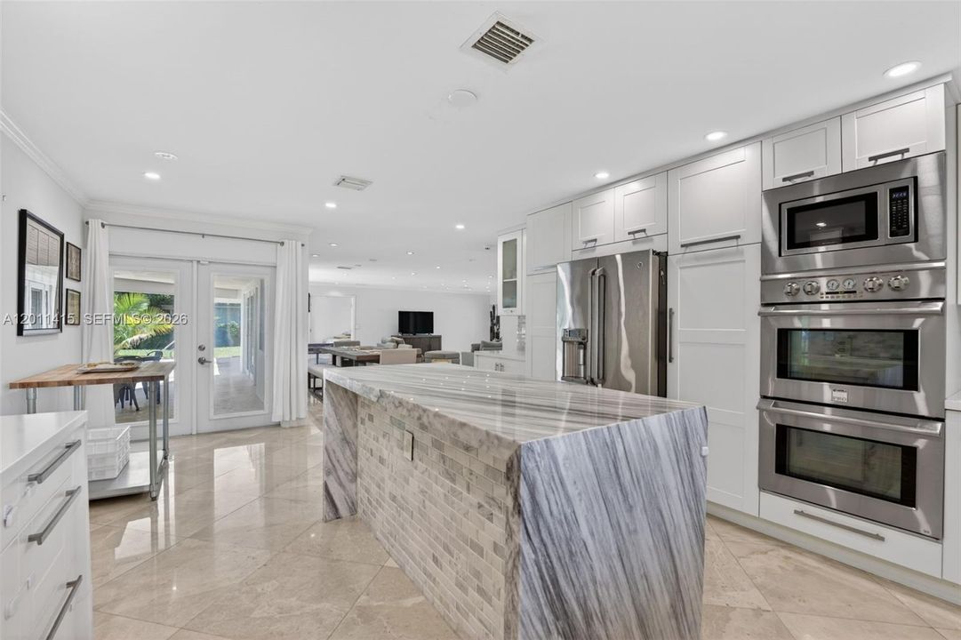 Chef’s kitchen is expansive with clear views of the dining and living room—perfect for entertaining!