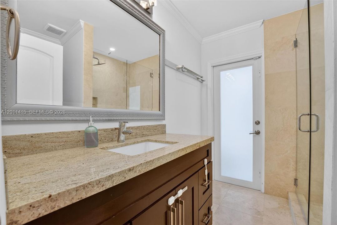 Cabana bathroom with convenient access to the pool area.