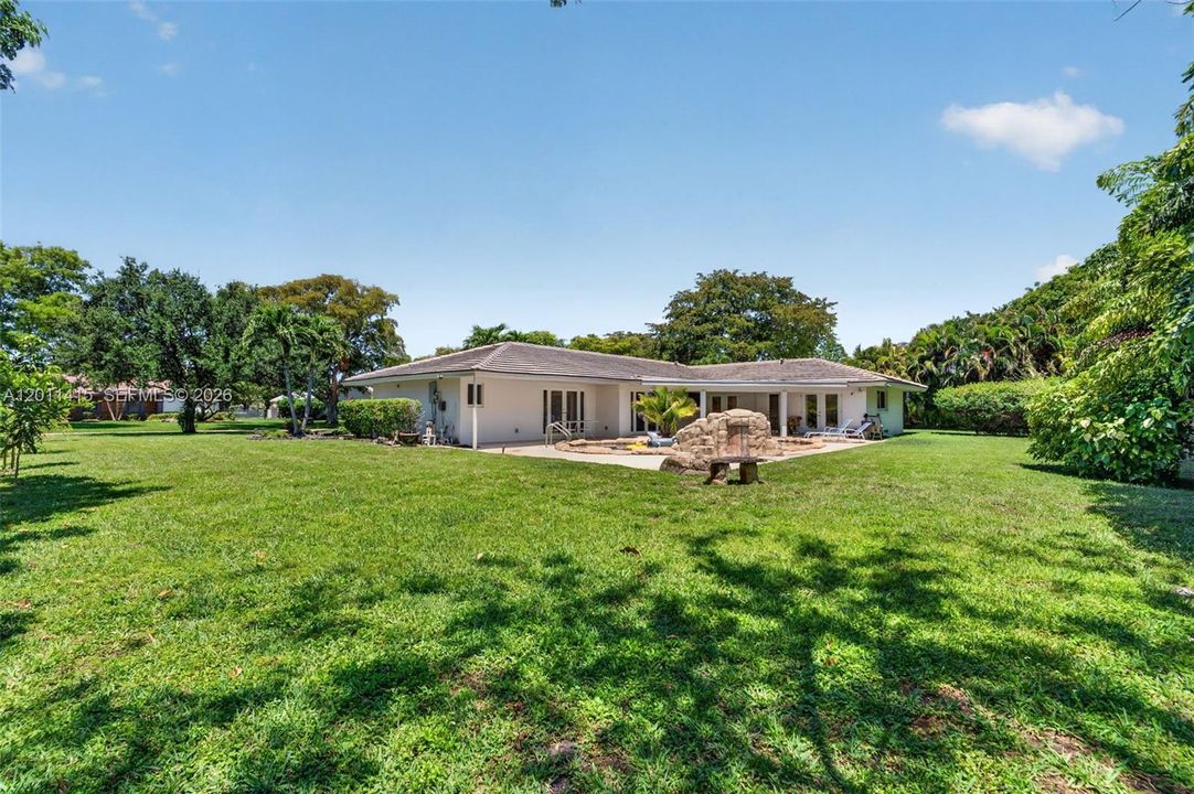 Oversized lot offers a spacious pool deck and generous green space—great for backyard barbecues, lawn games, picnics, and relaxing under the sun.
