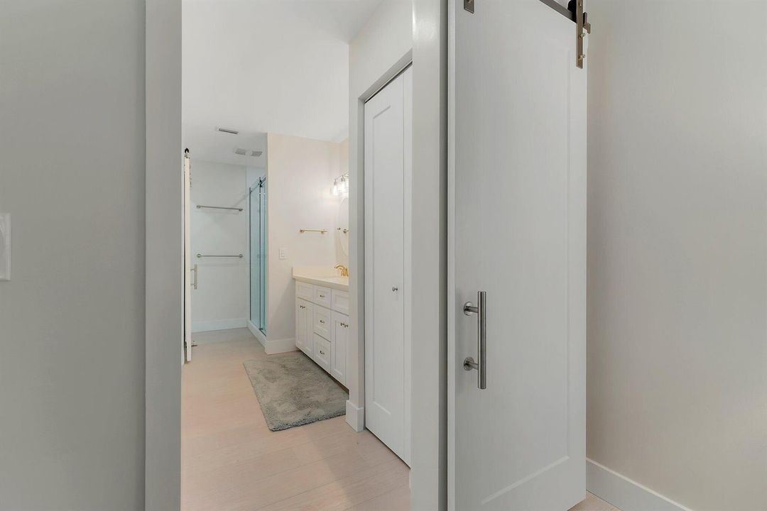 Barn doors leading to bath