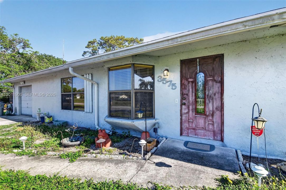 A canal facing home with no HOA & 1 car garage.