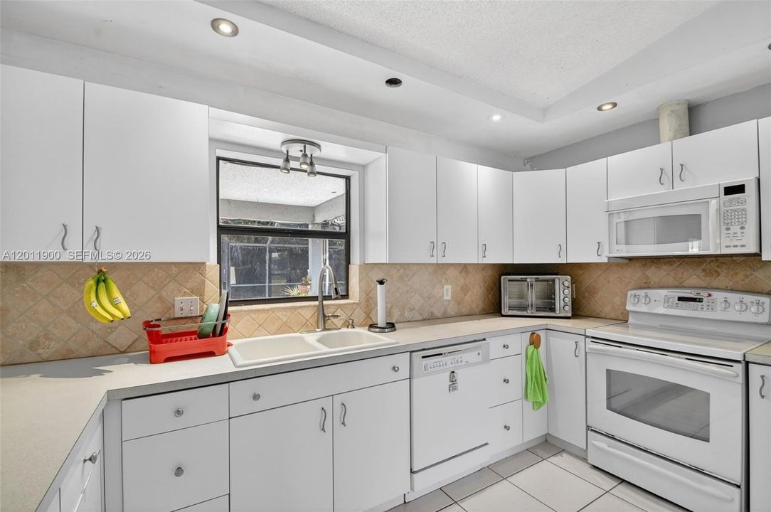 Plenty of storage in the large kitchen that overlooks your pool.