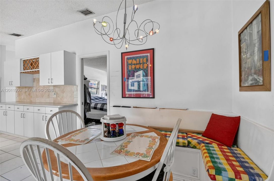 A dining area with French doors leading to your pool and patio.