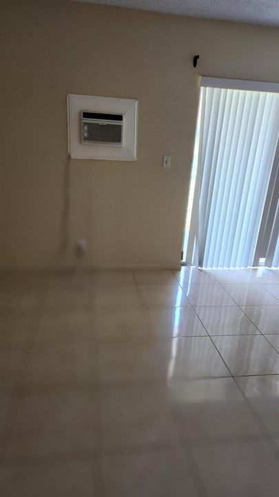 Main tiled bedroom with tile floor