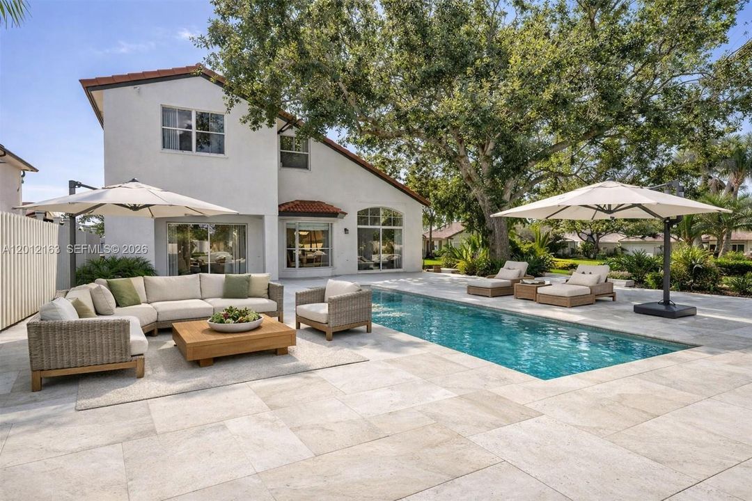 This home does NOT have a patio or pool.  This photo is AI generated to show back yard potential.