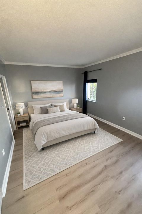 Virtually Staged Master Bedroom with French Doors that lead to the Patio