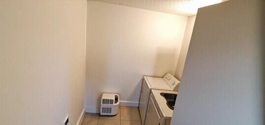 AI cleaned Washer Dryer in unit Room
