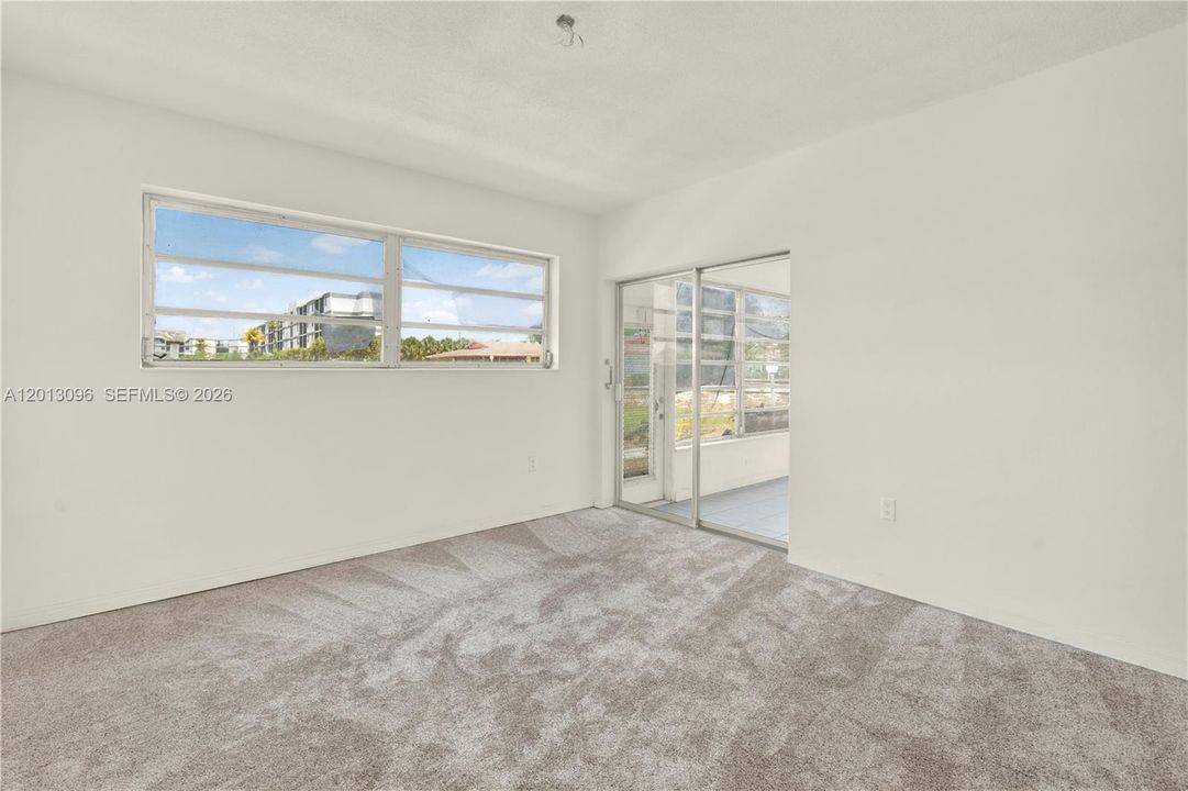 Picture has been virtually staged with carpet but there is no capet.  The floor is only cement and ready for you to put whichever flooring might fit you best.