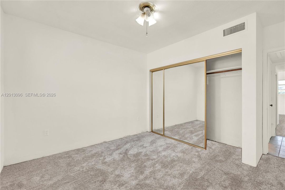 Picture has been virtually staged with carpet but there is no capet.  The floor is only cement and ready for you to put whichever flooring might fit you best.