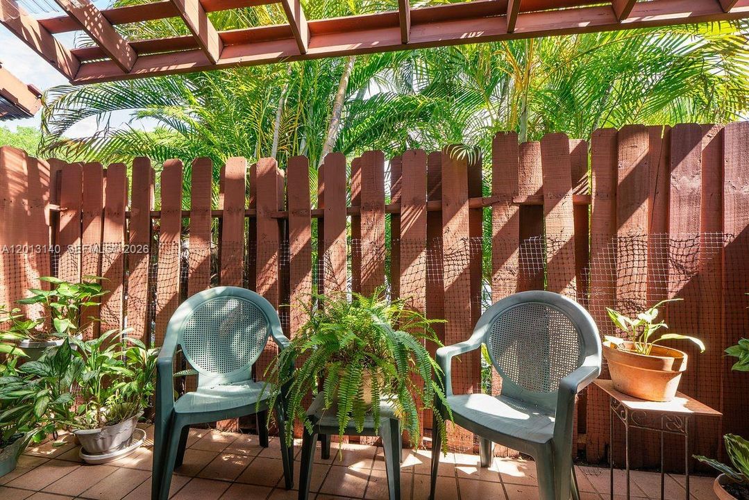 Lush, private fenced patio off living area