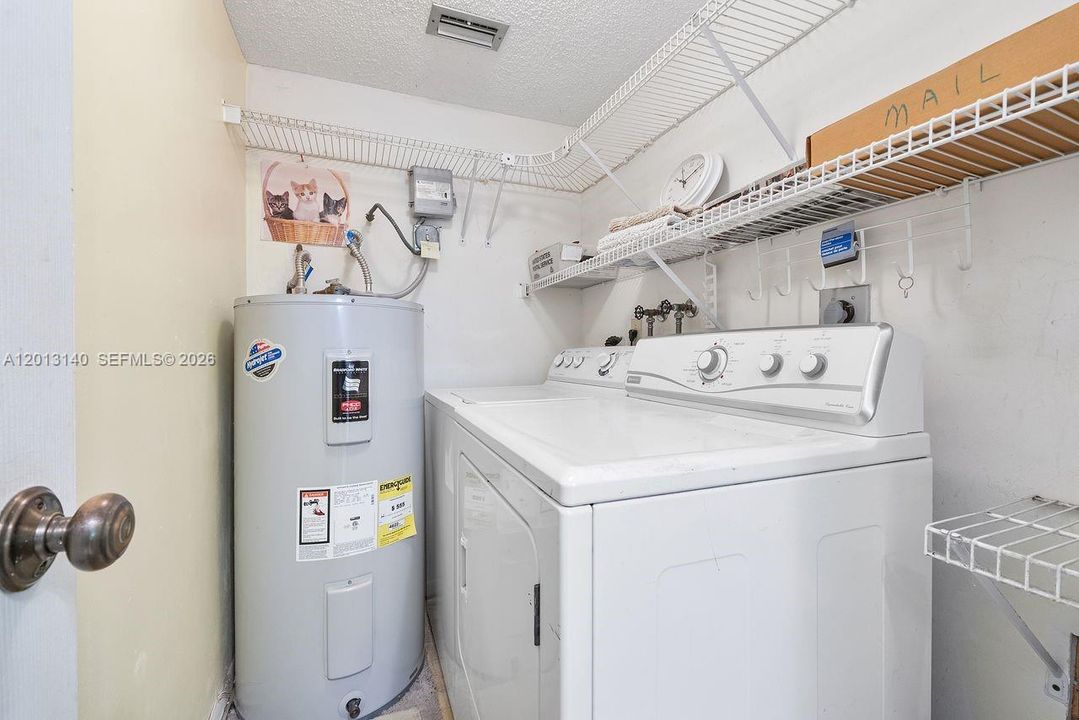Spacious 1st floor laundry room, hot water heater