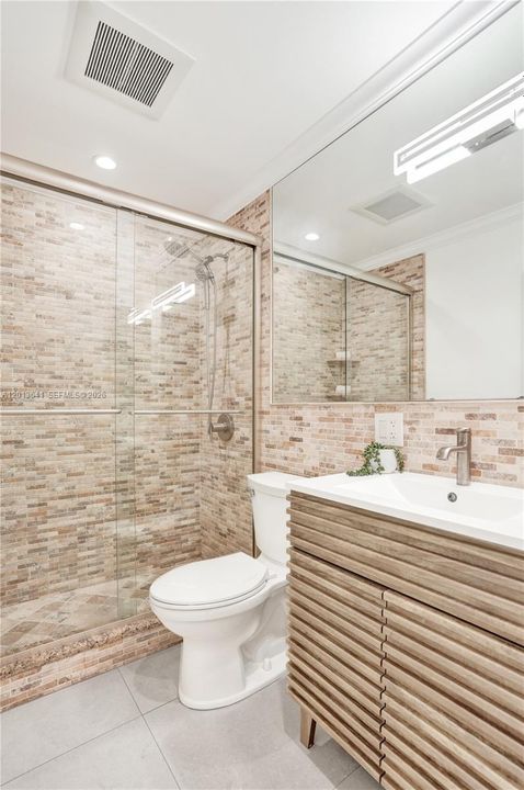 Renovated guess bath, situated on the first floor. Immediately to the left as you enter the home.