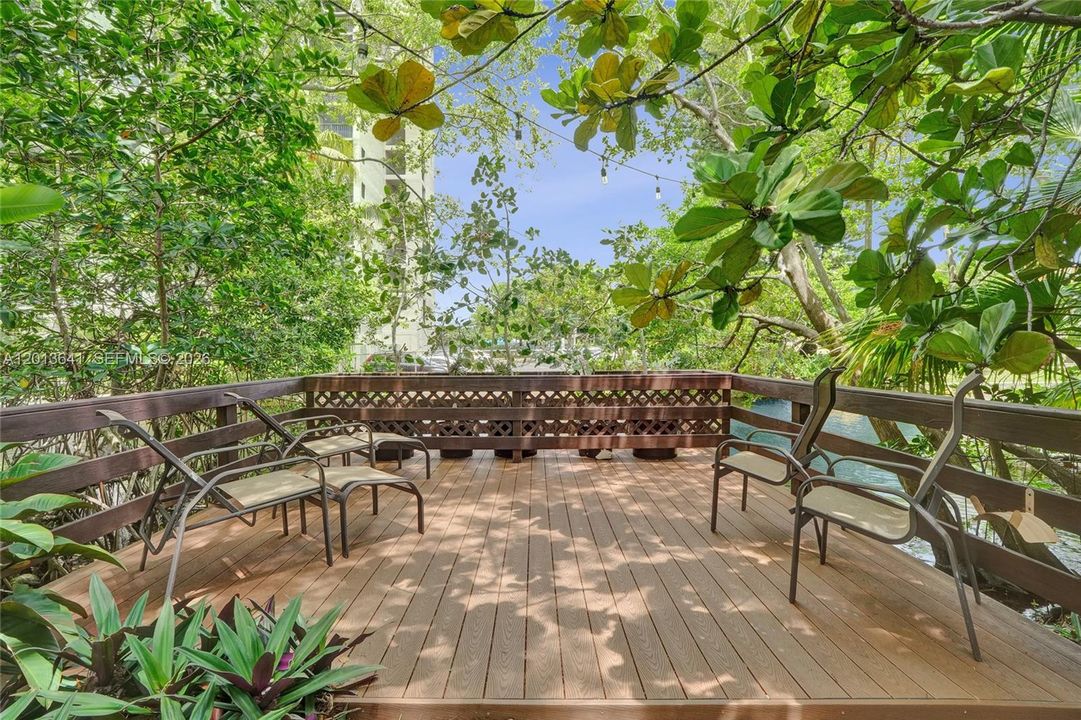 Enjoy a private deck with peaceful views of the canal and surrounding nature preserve.