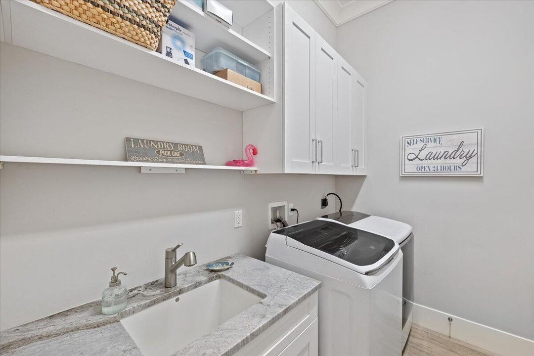 Laundry Room with sink and drying area