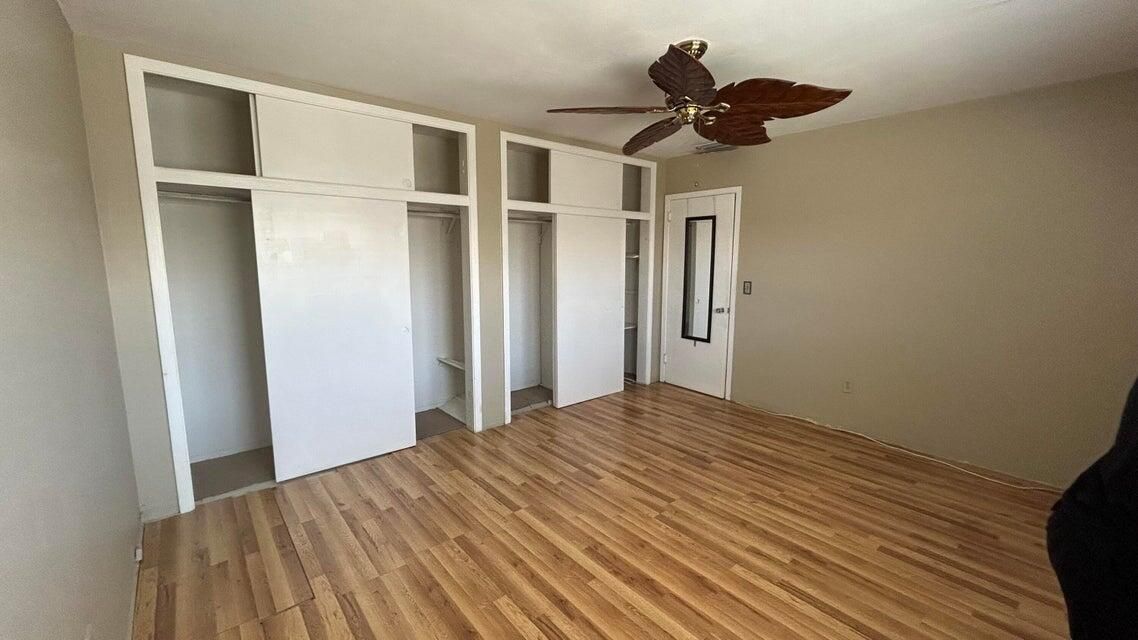 wall of closets in bedroom