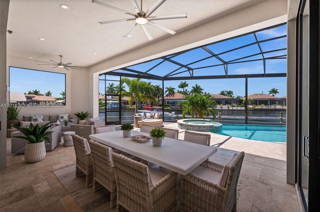 Large covered lanai with dining and sitting areas